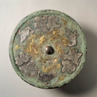 Mirror with Flowers and Birds in Gold and Silver Cutouts over a Lacquer Base, mid 8th century.