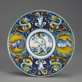 Dish with Cupid on a Hobbyhorse, Tondino, Possible Urbino area, Venice, or Pesaro, Italy; about 1510 - 1520; Tin-glazed