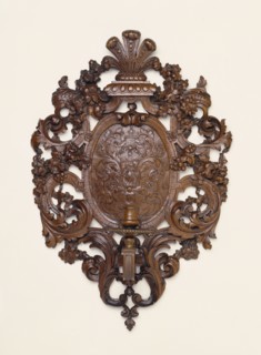 Wall Light; Nancy, Lorraine, France; about 1700; Carved fruitwood, perhaps bois de Sainte-Lucie, 43.2 x 29.5 x 12.7 cm