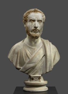 Portrait Bust of a Man, Perhaps a Priest of Serapis; Roman Empire; 180 - 220; Marble with polychromy and gilding; 79.5 × 49 × 27