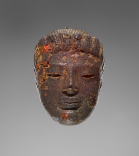 Pendant: Head of a Female Divinity or Sphinx; Tarentum, ?, Italy; 550 - 520 B.C; Amber; 34.5 × 24 × 16 mm