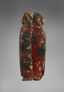 Pendant: Addorsed Females; Italy; 600 - 550 B.C; Amber; 40 × 102 × 13 mm, 39.3 g, 1 9,16 × 4 × 1,2 in., 0.0866 lb