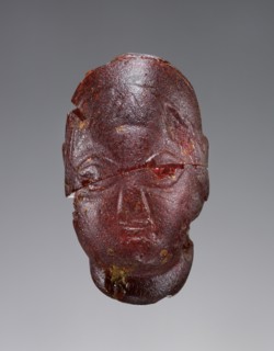 Pendant: Female Head; Italy; 500 - 480 B.C; Amber; 42 × 24 × 29 mm, 1 5,8 × 15,16 × 1 1,8 in