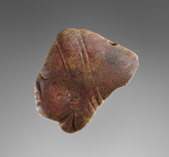 Pendant: Female Head in Profile; Italy; 500 - 480 B.C; Amber; 44 × 38 × 16 mm, 1 3,4 × 1 1,2 × 5,8 in