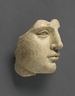 Fragment of a Head; Tarentum, Taras, South Italy; 440 - 430 B.C; Terracotta with clay slip; 14.2 × 14 cm, 5 9,16 × 5 1,2 in