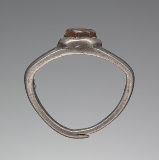 Engraved Gem Inset Into A Ring; 3rd century; Gem: carnelian; ring: silver; 0.7 × 0.6 × 0.3 cm, 1,4 × 3,16 × 1,8 in