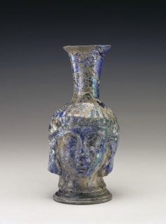 Flask in the Shape of a Head; Roman Empire; 4th - 5th century; Glass; 17.2 × 8 cm, 6 3,4 × 3 1,8 in