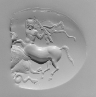 Engraved Scaraboid; first quarter of 4th century B.C; Brown chalcedony; 4.2 × 3.8 × 1.3 cm, 1 5,8 × 1 1,2 × 1,2 in