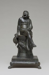 Incense Burner Shaped as a Comic Actor Seated on an Altar; Roman Empire; first half of 1st century; Bronze with silver inlay