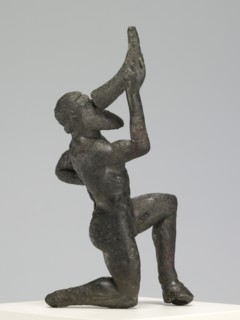 Statuette of a Kneeling Satyr; Greece; 480 - 460 B.C; Bronze; 9.8 × 4.1 × 5.4 cm, 3 7,8 × 1 5,8 × 2 1,8 in
