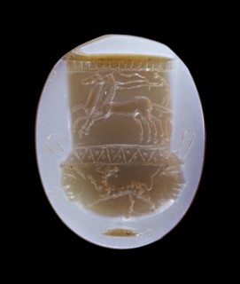Gem: Mixing Vessel Decorated with a Chariot and a Panther; Italy; 1st century B.C; Banded agate, blue and brown; 1.6 × 1.3 × 0.3
