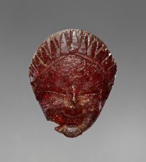 Pendant: Head of a Female Divinity or Sphinx; Italy; 550 - 525 B.C; Amber; 32 × 26 × 12 mm, 1 1,4 × 1 × 1,2 in