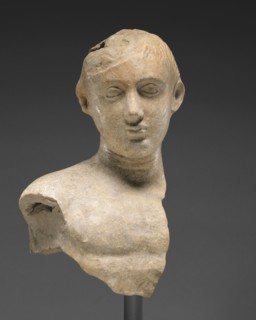 Bust of a Youth; Tarentum, Taras, South Italy; 425 - 300 B.C; Terracotta with white slip and polychromy, red, pink, 26.8 × 15.