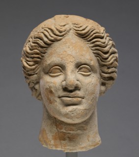 Head of a Woman; Orpheus Master; Tarentum, Taras, South Italy; 350 - 300 B.C; Terracotta with clay slip; 16.5 × 12.6 cm
