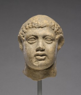 Head of a Man; Tarentum, Taras, South Italy; 400 - 300 B.C; Terracotta with clay slip; 13.1 × 9.1 cm, 5 3,16 × 3 9,16 in