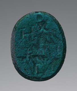 Engraved Gem, Roman Empire; 2nd - 4th century; Greenish-blue glass; 2 × 1.6 cm, 13,16 × 5,8 in