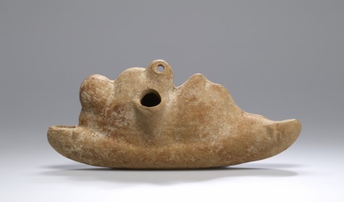 Lamp with a Reclining Comic Actor; Roman Empire; 2nd century; Terracotta and pigment; 7 × 16.3 cm, 2 3,4 × 6 7,16 in