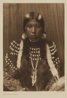 Dusty Dress - Kalispel; Edward S. Curtis, American, 1868 - 1952, 1910; Gravure; 40.1 x 28.1 cm 15 13,16 x 11 1,16 in