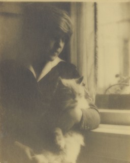 Portrait of a Woman Posed with a Cat Near a Window; Clarence H. White, American, 1871 - 1925, 1918 - 1920; Toned gelatin silver