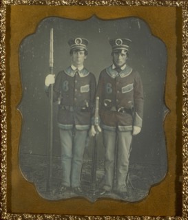 Portrait of Two Young Men in Uniform; American; about 1852; Daguerreotype, hand-colored; 7 x 5.6 cm 2 3,4 x 2 3,16 in
