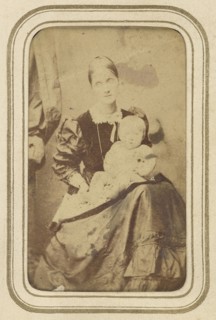 Mrs. Herbert Duckworth and child; 1865; Albumen silver print
