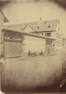 Figures with carts along road; European; about 1870 - 1880; Albumen silver print