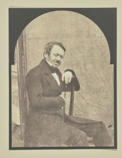 man seated before a portable backdrop; Hippolyte Bayard, French, 1801 - 1887, 1847; Salted paper print from a Calotype negative