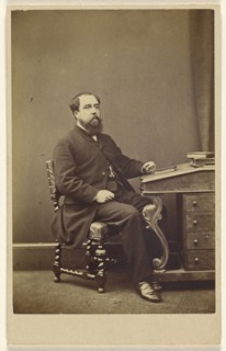 bearded man seated at writing desk, in 3,4 profile; London Stereoscopic and Photographic Company; about 1865; Albumen silver