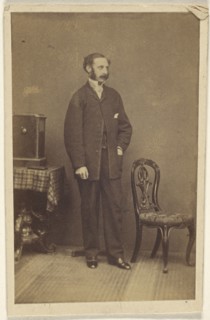 man with moustache & muttonchops, standing; 1860s; Albumen silver print