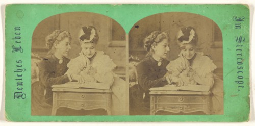 Mother and daughter looking at a book, leaning on a table; German; 1860s; Albumen silver print