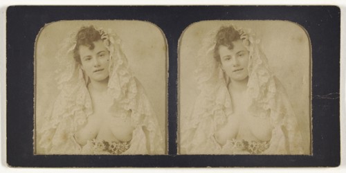 Woman wearing a lace mantilla with breasts exposed; French; 1855 - 1860; Hand-colored Albumen silver print