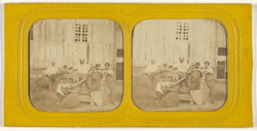 Men working on hay chafing machine; about 1865; Hand-colored Albumen silver print