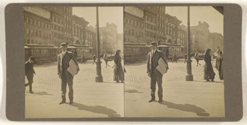 Man on street with stack of newspapers under his arm, Albany, N.Y; Julius M. Wendt, American, active 1900s - 1910s, 1900s