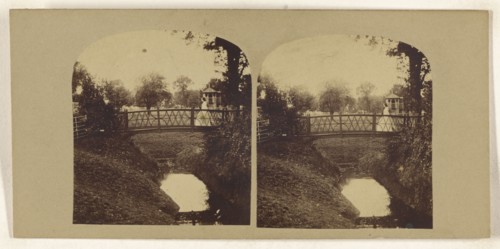 Woman crossing footbridge over stream; British; about 1860; Albumen silver print