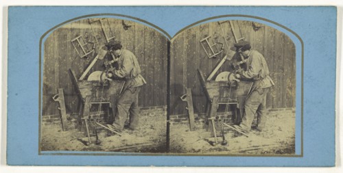 Man sharpening blade on foot-operated whetstone; French; about 1865; Albumen silver print