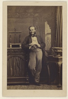 man with muttonchops, standing, holding a newspaper; Camille Silvy, French, 1834 - 1910, 1860s; Albumen silver print