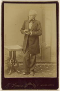 A Game of Cards, actor holding playing cards, standing; Theophile W.M. Havee, American, 1848 - 1921, active Stamford