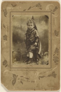 Little boy holding an American flag, standing on a chair; A. Rinin, American, active 1900s, about 1900; Gelatin silver print
