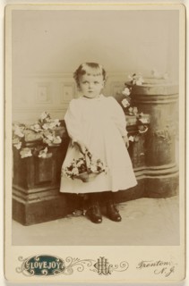little girl standing, holding a basket of flowers; Henry C. Lovejoy, American, active Trenton, New Jersey 1860s - 1890s)