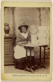 man dressed as a woman seated at a table wrapping chocolates; Henry McCobb, American, active New York, New York 1880s, 1886