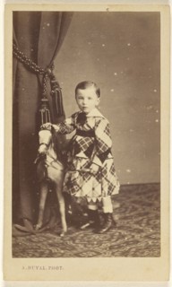 little boy standing with toy pony; A. Duval, French, active 1880s, about 1865; Albumen silver print