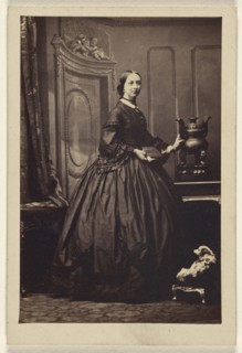 woman holding a book,standing; Camille Silvy, French, 1834 - 1910, 1862 - 1865; Albumen silver print