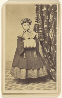 little girl dressed in winter clothing with hand muff, standing; Emery R. Gard, American, active 1856 - 1866, 1865 - 1870