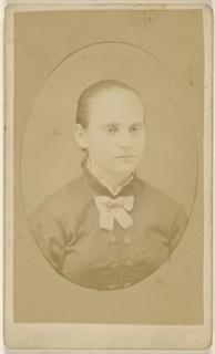 woman with her hair pulled back, printed in quasi-oval style; 1870 - 1875; Albumen silver print