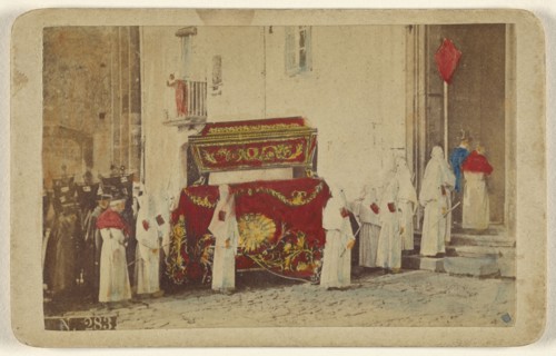 Funeral procession with men wearing white-hooded outfits; Fotografia Marittima; 1865 - 1870; Hand-colored albumen silver print