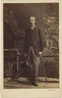 man with moustache, holding a top hat and umbrella, standing; Southwell Brothers, English, 1862 - 1878, 1863 - 1864; Albumen