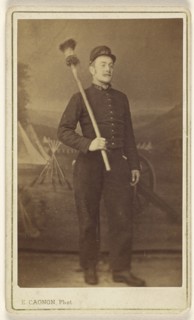 man in uniform standing, with what is possibly a cannon sponge over his shoulder; E. Cagon, French, active Argentina 1860s