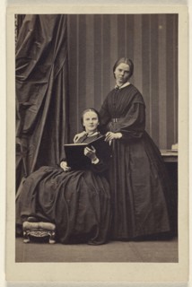 E.J.B. two  women: one seated, holding a book; one standing; Camille Silvy, French, 1834 - 1910, about 1866; Albumen silver