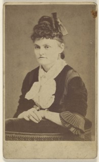 woman seated, leaning on chair arm; T.M. Saurman, American, 1846 - 1908, active Norristown, Pennsylvania, 1870 - 1875; Albumen