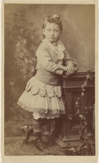 little girl, standing, leaning on a studio prop; Lee Stearns, American, active 1870s - 1910s, 1870 - 1875; Albumen silver print